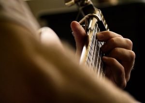 playing guitar | guitar lessons in Arlington